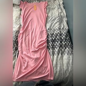 Pink Maternity body cone dress.